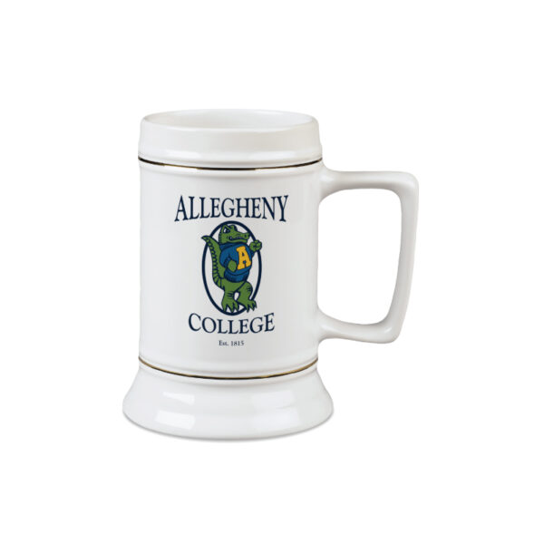 White ceramic tankard mug with handle. Front facing vintage gator logo with Navy Allegheny College text above and below the gator. Gold lining around the tankard below and above the handle.